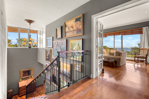 Stairs lead up to a further living room