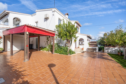 Large front terrace with double garage